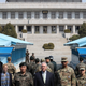Secretary of State Rex Tillerson stands with UN, American, and South Korean forces at the border of South Korea and North Korea as soldiers from the North take photos in the distance (AP Photo/Lee Jin-man, Pool)
